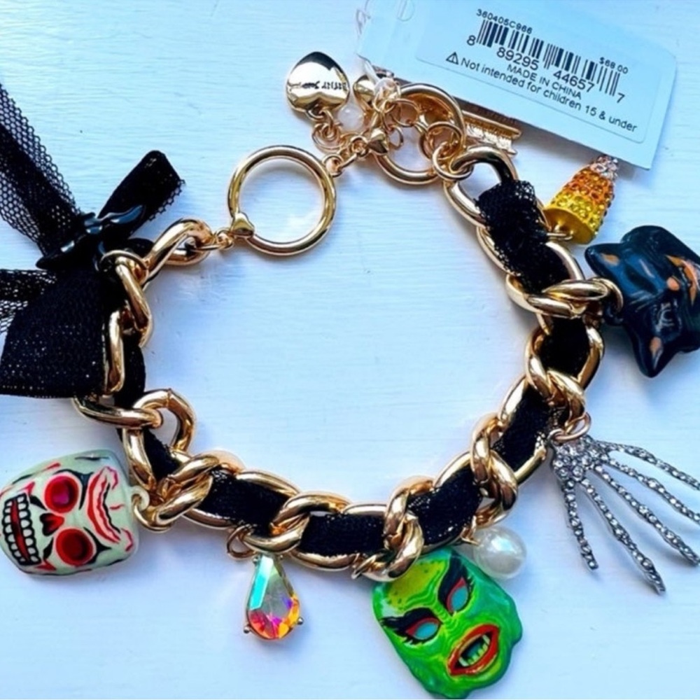 Gold and Black Charm Bracelet with Playful Charms